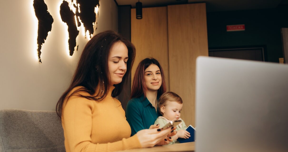 a young mother with a child in a travel agency