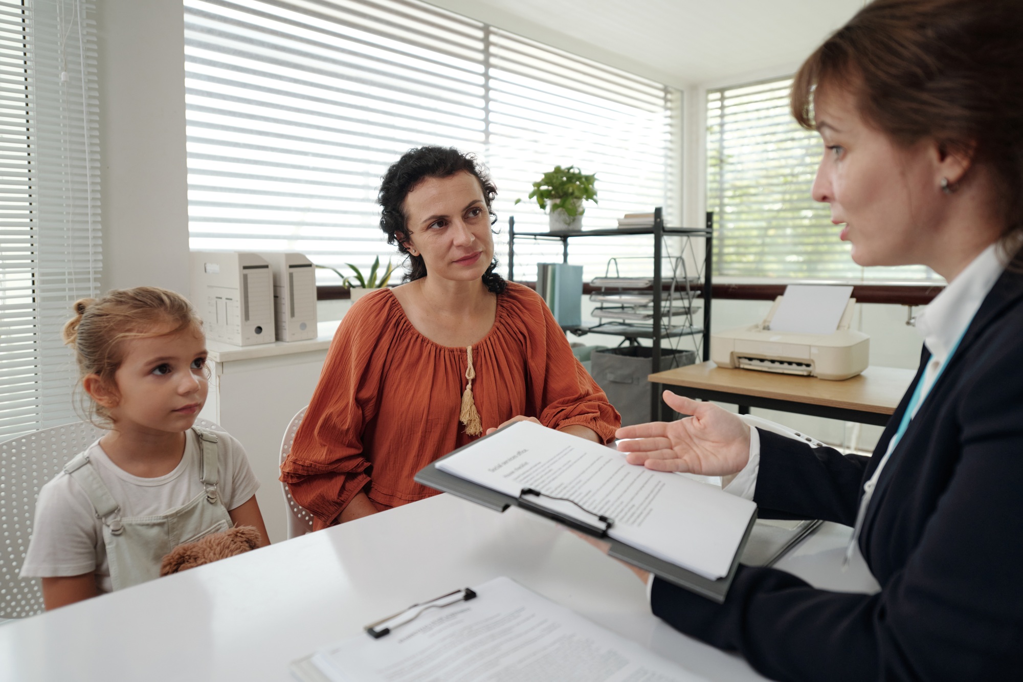 Social Worker Talking To Child